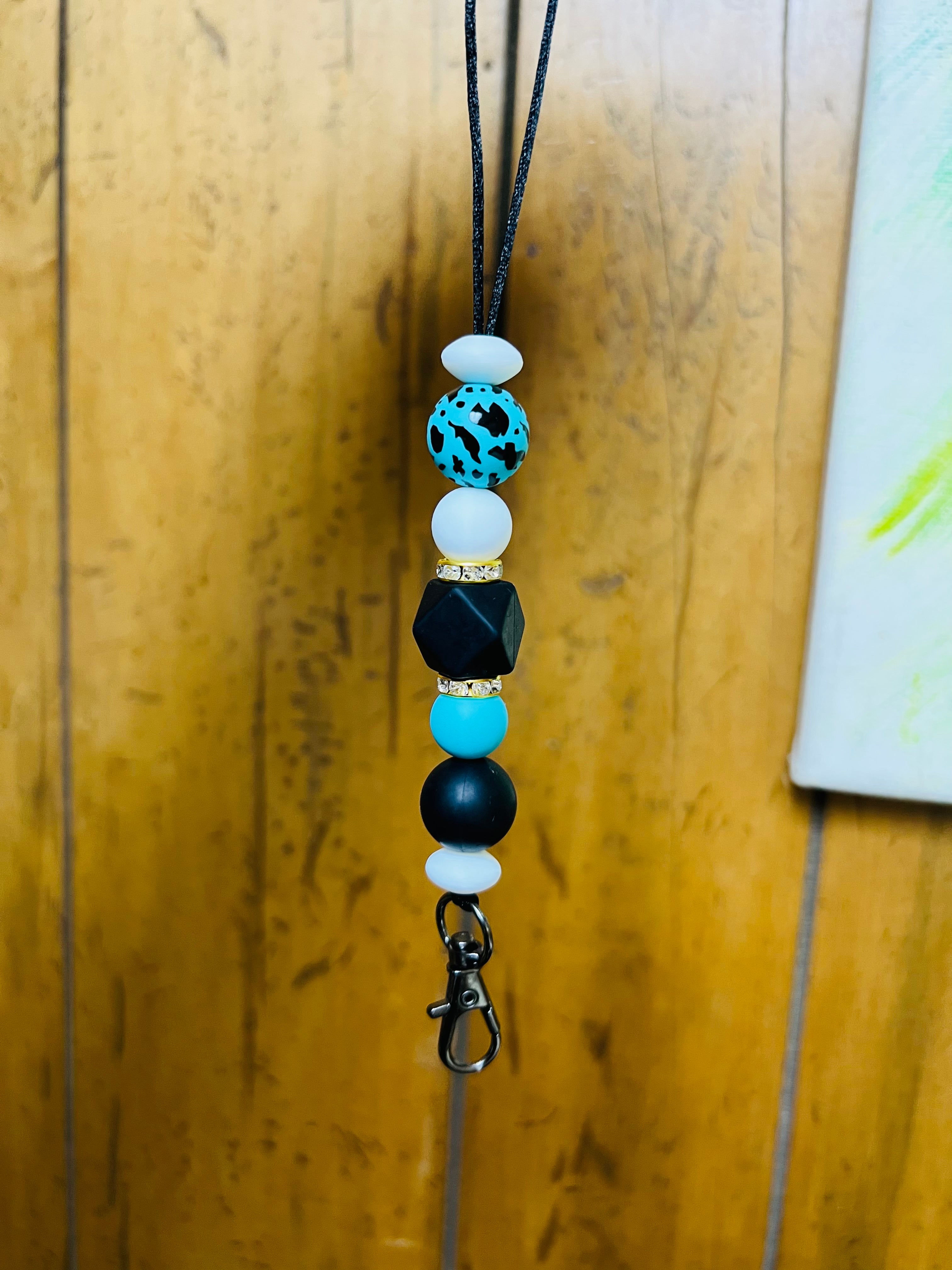 Teal & black cow print car hanger